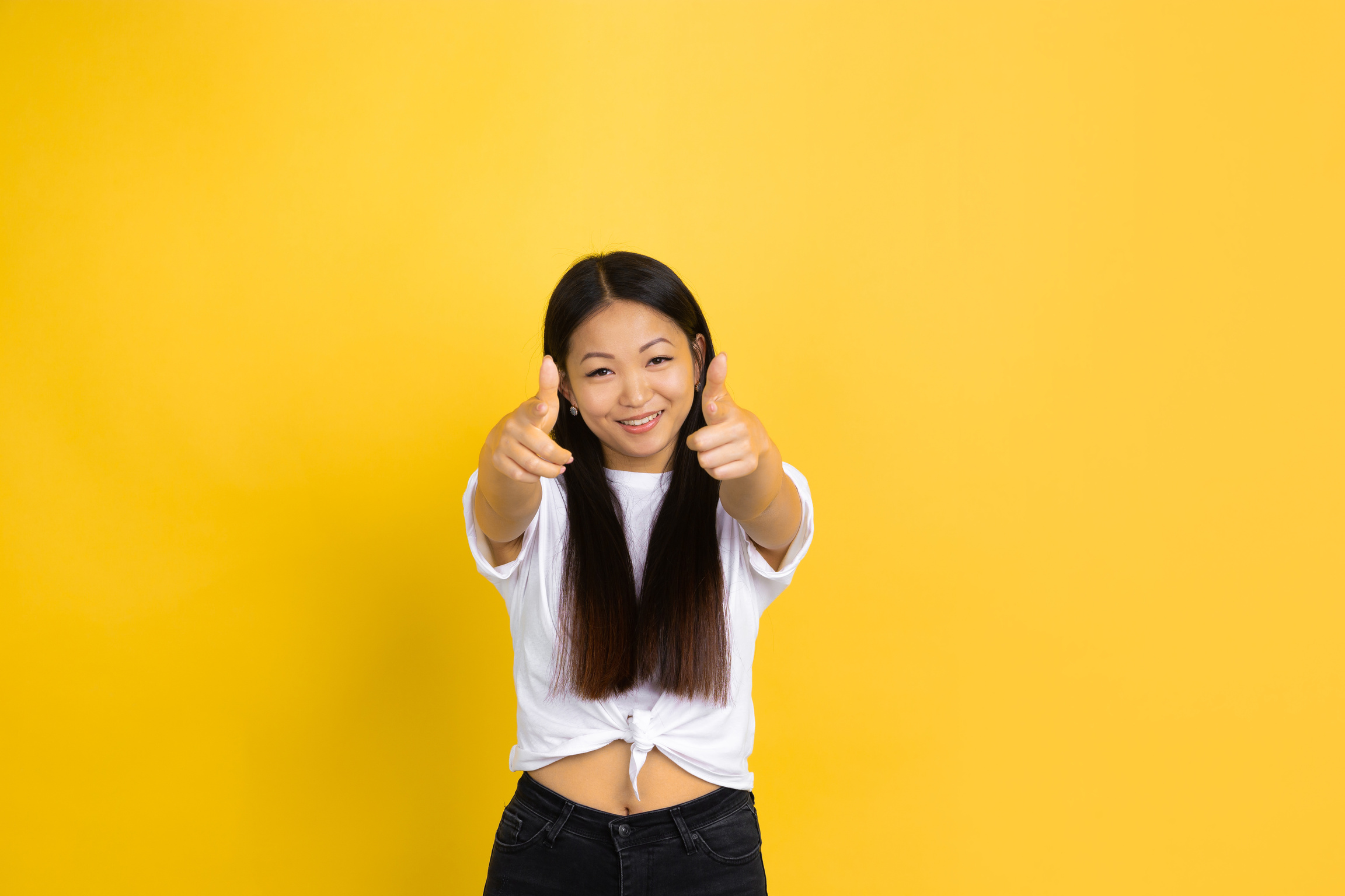 Young Woman Pointing Forward